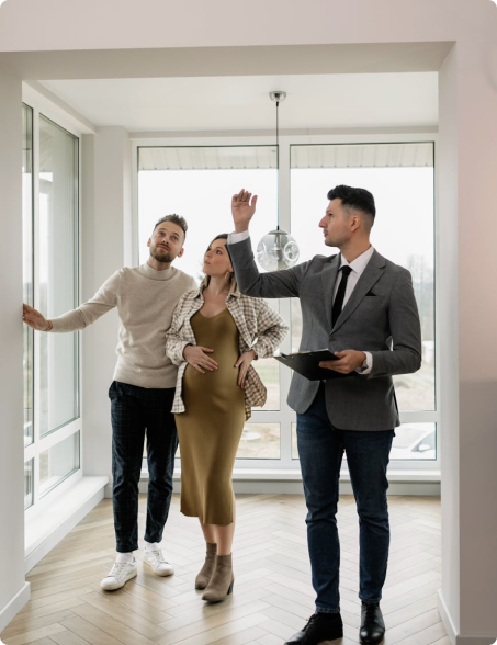 Couple and real estate agent in a new home